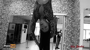 A stunning woman performs a sensual pole dance before engaging in intense anal and oral sex