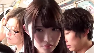 Aroused Japanese beauty in a short skirt receives attention on a crowded bus, escalating to intense intimacy