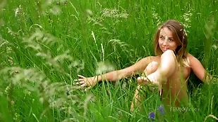 Blonde teen explores her sexual awakening in nature