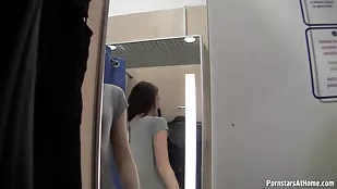 Clothed pornstars in a steamy retail changing room encounter