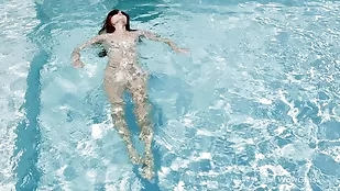 Mila's seductive solo swim routine reveals her innocent and youthful charm